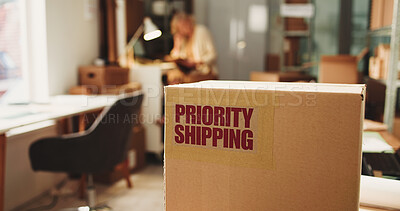 Buy stock photo Label, priority shipping and box in office for distribution with logistics for freight delivery. Person, cardboard package and ecommerce parcel with express service for cargo, supply chain or export.