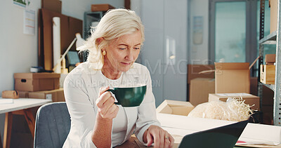 Buy stock photo Laptop, supply chain and coffee break with mature woman in office for delivery, retail update or shipping. Tech, drink and small business owner with logistics for package, distribution and stock