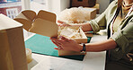 Hands, woman and box at startup ecommerce for packaging, prep shipping and parcel note. Female person, packing and label for package delivery, order information and quality control for distribution