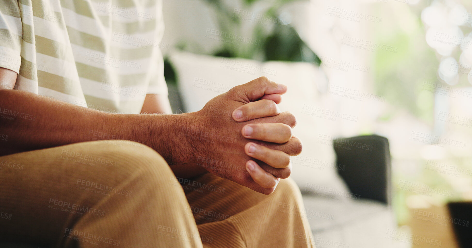 Buy stock photo Hands, anxiety and man on sofa in home with stress, phobia or stimming for panic attack with mental health. Overthink, crisis and male person in living room with trauma, fear or trigger in house.