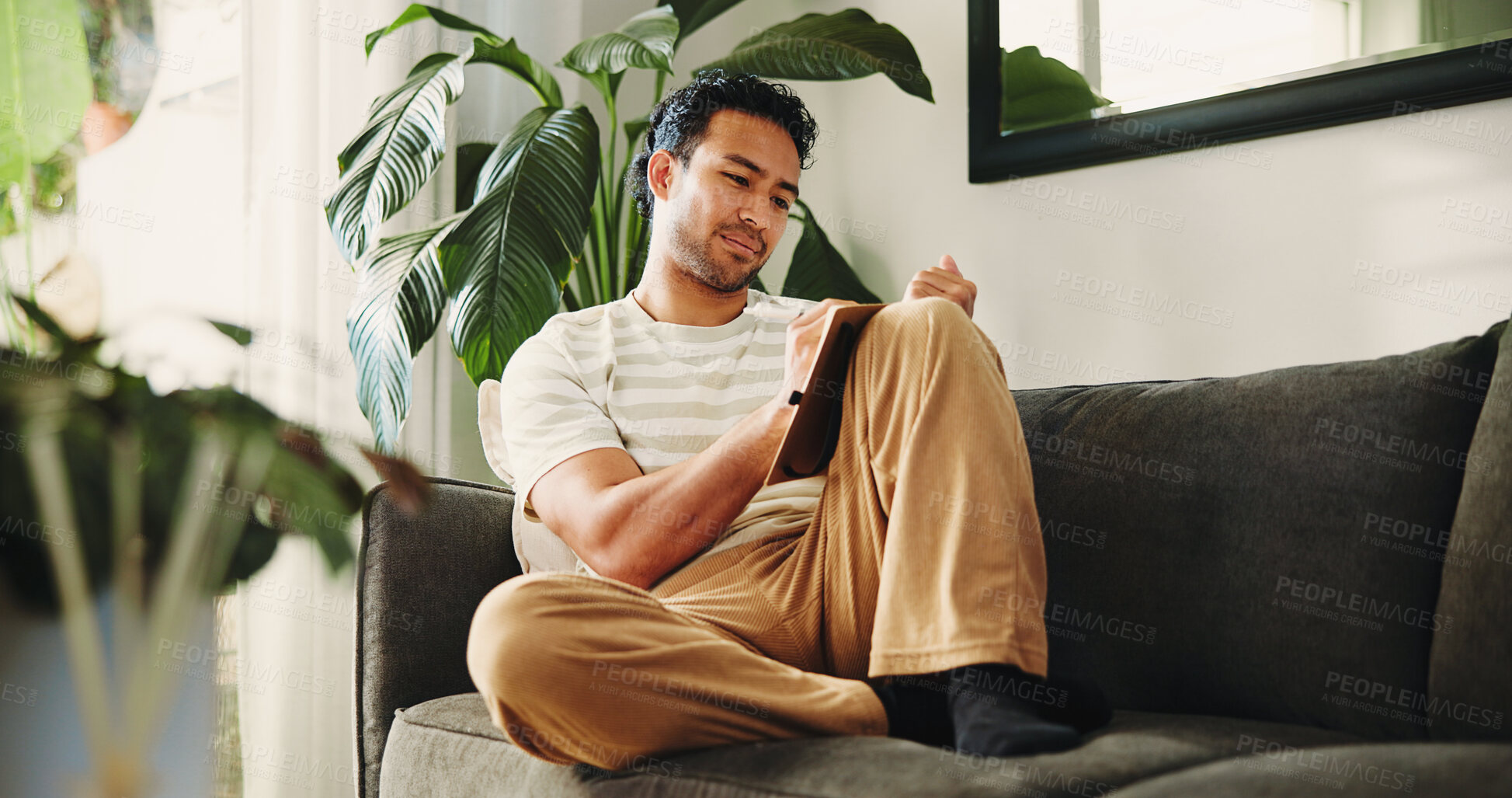 Buy stock photo Man, journal and writing on sofa in house, daily reflection or idea notes to relax for creativity. Person, notebook for planning or sketching with agenda in diary, to do list or goal setting in home