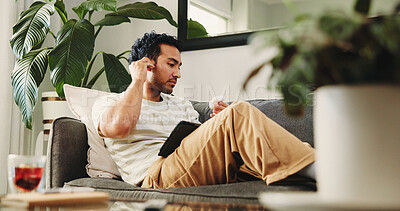 Buy stock photo Man, relax and earphones with tablet in living room for movie, streaming film or listen to audio. Person, home and digital tech for social media, online podcast and sound for music entertainment