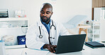 Doctor, black man and paperwork in office with laptop for health insurance, typing report and review. Healthcare worker, person and reading document in clinic with computer, medical aid and research.