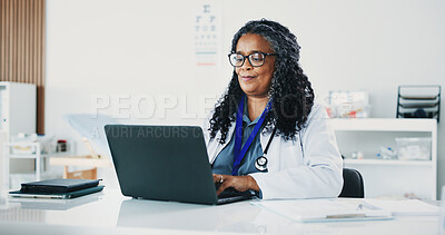 Buy stock photo Doctor, black woman or reading with laptop in hospital office, digital resources or healthcare database. Medical archive, research or mature physician with pc for telehealth, patient admin or info