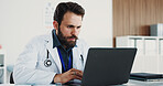 Typing, man and portrait of doctor with laptop for medical, healthcare or admin in office. Cardiologist, professional person and digital tech with clinic schedule, telehealth or research for service