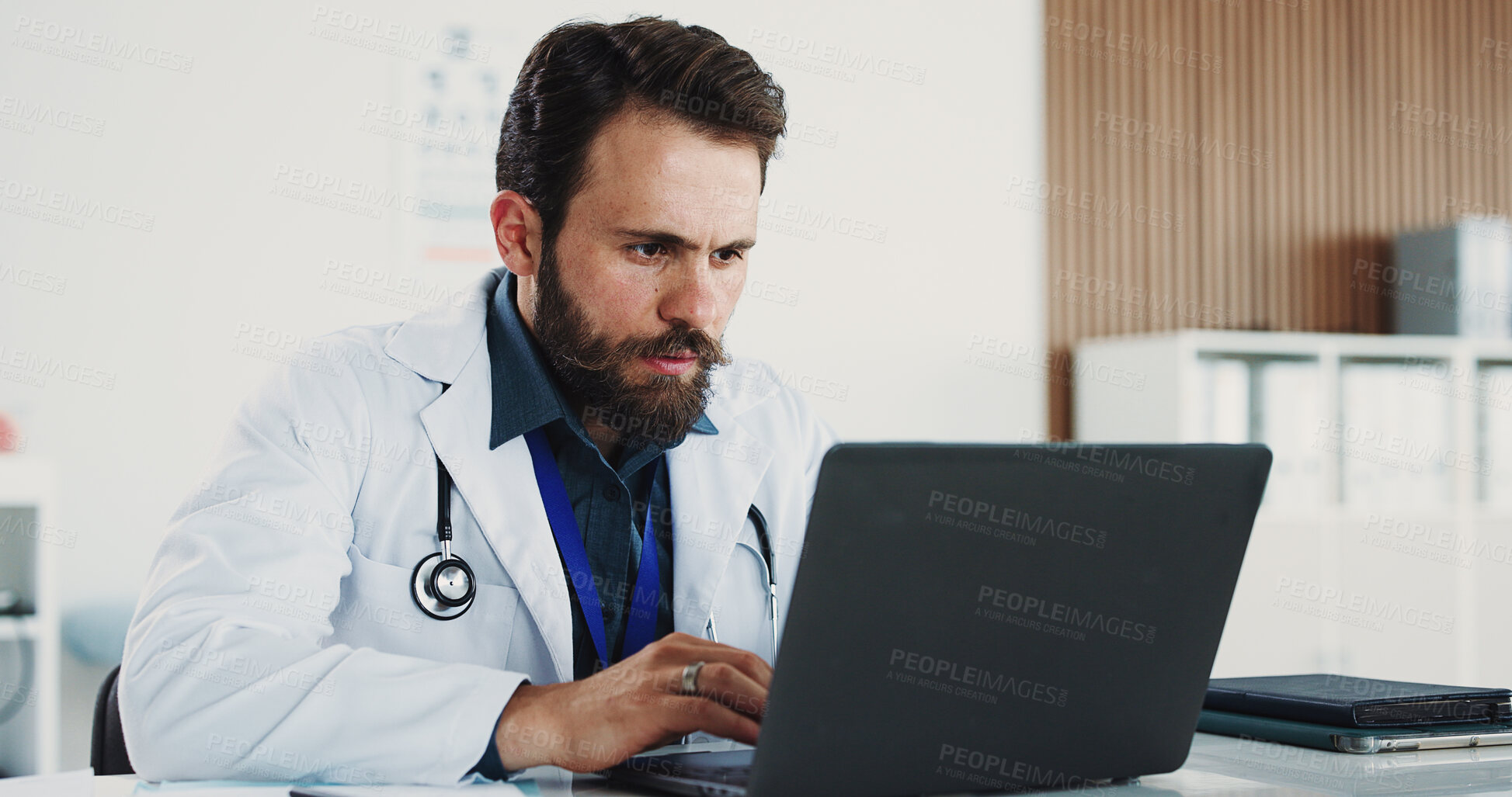 Buy stock photo Typing, man and doctor with laptop for medical, healthcare or admin in office. Cardiologist, professional person and digital tech with clinic schedule, telehealth or research for specialist service