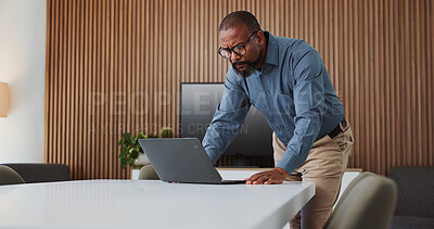 Buy stock photo Confused, business and black man with laptop in office for bad news, accounting and finance mistake. Frustrated, mature person and pc for website glitch, financial bankruptcy and bookkeeping disaster