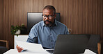 Black man, accountant or documents with laptop for finance report, expenses or audit in office. Male person, accounting or analyst with computer or paperwork for financial planning, budget or revenue