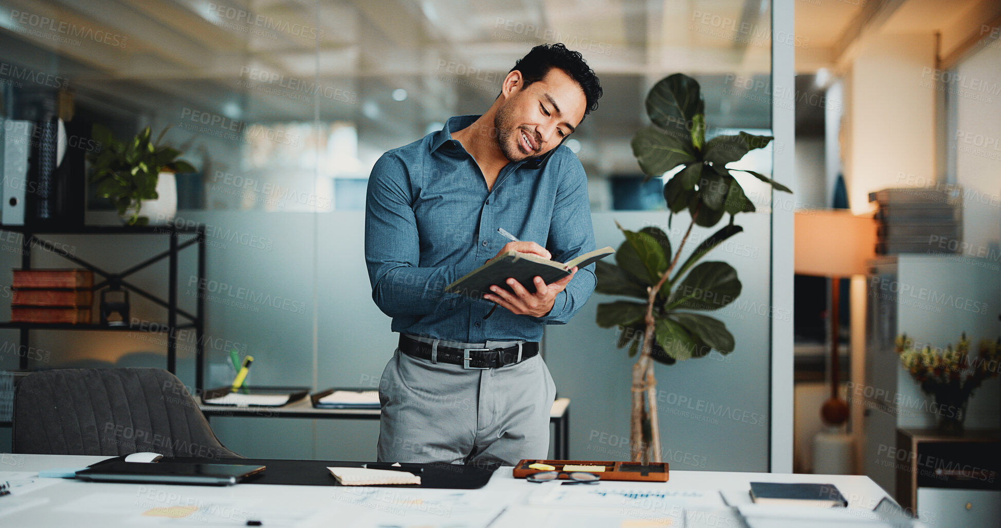 Buy stock photo Creative agency, phone call and man with notebook, discussion and conversation for article report. Business person, journalist and paperwork in office with checklist, feedback and graph communication
