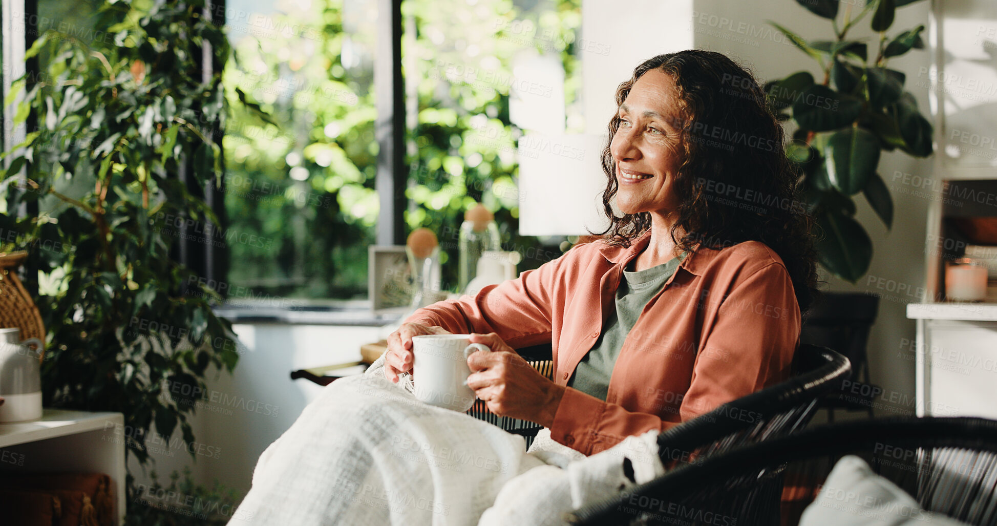 Buy stock photo Home, thinking and woman with coffee, relax and reflection with memory, smile and comfort in lounge. Retirement, remember and mature person with tea, daydreaming and decision with moment and cosy