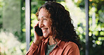 Happy woman, listening and communication with phone call in home for conversation or friendly chat. Female person, talking or smile on mobile smartphone for network, discussion or connection in house