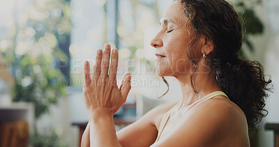 Buy stock photo Mindfulness, yoga or woman with prayer hands in home, awareness practice or grounding exercise. Peace, meditation or mature person with holistic activity for wellness, reduce stress or spiritual zen