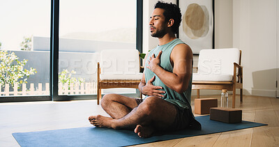 Buy stock photo Mindfulness, yoga and man in home, breathing and meditation for inner peace, calm or wellness on mat. Zen, person and spiritual awareness for mental health, yogi and inhale for stress relief on floor