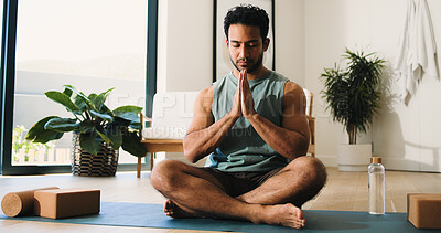 Buy stock photo Calm, meditation and man in home, yoga and namaste for inner peace, mindfulness and wellness on mat. Zen, person and spiritual awareness for mental health, yogi and prayer hands for stress relief
