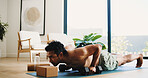 Fitness, man and plank in home with weights for balance exercise, strength training or bodybuilding. Active, person and dumbbells on floor with core engagement for stability, workout and performance.