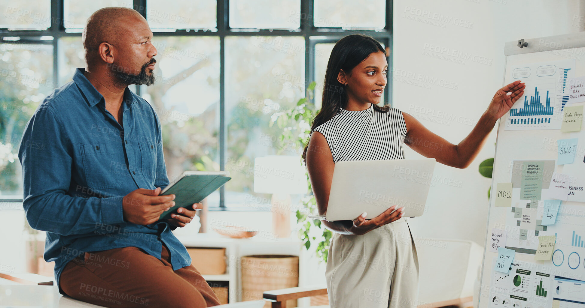 Buy stock photo Creative people, documents and tech with designer agency in office for internship or project management. Graphs, meeting or paperwork with woman, man or mentor in workplace for conversation or update