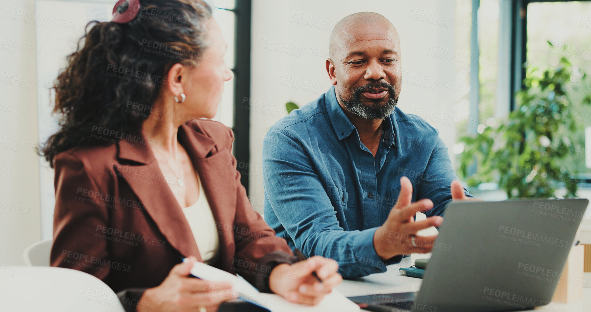 Buy stock photo Business people, notebook and laptop with discussion in office for finance agency or project management. Tech, meeting and accounting with man, woman and mentor in workplace for update conversation