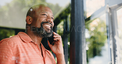 Buy stock photo Phone call, happy and black man in home by window for conversation, chatting and connection. Low angle, smile and person on smartphone for communication, contact and speaking for social networking