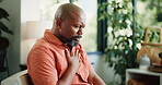 Sick, chest pain and black man in home with cough, infection or breathing issue from lung virus. Influenza, choking and mature person in house with tuberculosis, asthma or illness in allergy season