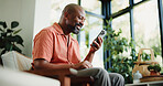 Lounge, reading or black man with phone in home, internet search or check social media from low angle. Smile, funny blog post or mature person with mobile for forum discussion, comic story or browse