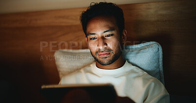 Buy stock photo Tablet, relax and man in bed in home for watching movie, series or film for entertainment. Digital technology, app and male person streaming show online on website in bedroom on weekend in apartment.