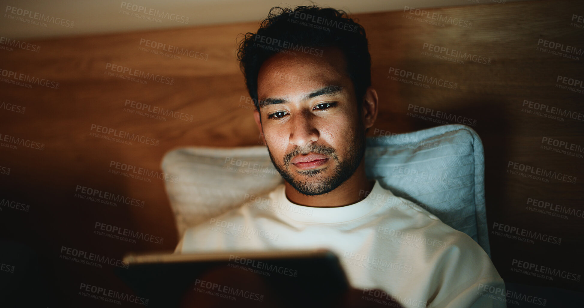 Buy stock photo Tablet, relax and man in bed in home for watching movie, series or film for entertainment. Digital technology, app and male person streaming show online on website in bedroom on weekend in apartment.