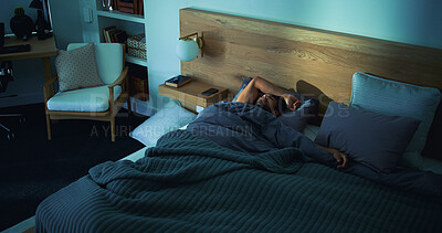 Buy stock photo Sleeping, rest and man in bed in home on weekend with exhaustion, fatigue or burnout with dreaming. Relax, above and tired male person with nap in bedroom with blanket for comfort in apartment.