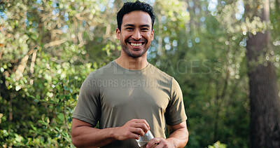 Buy stock photo Happy man, portrait and fitness with water bottle in nature for hydration or outdoor recovery. Active, male person or runner with smile or mineral liquid for natural sustainability or break in forest