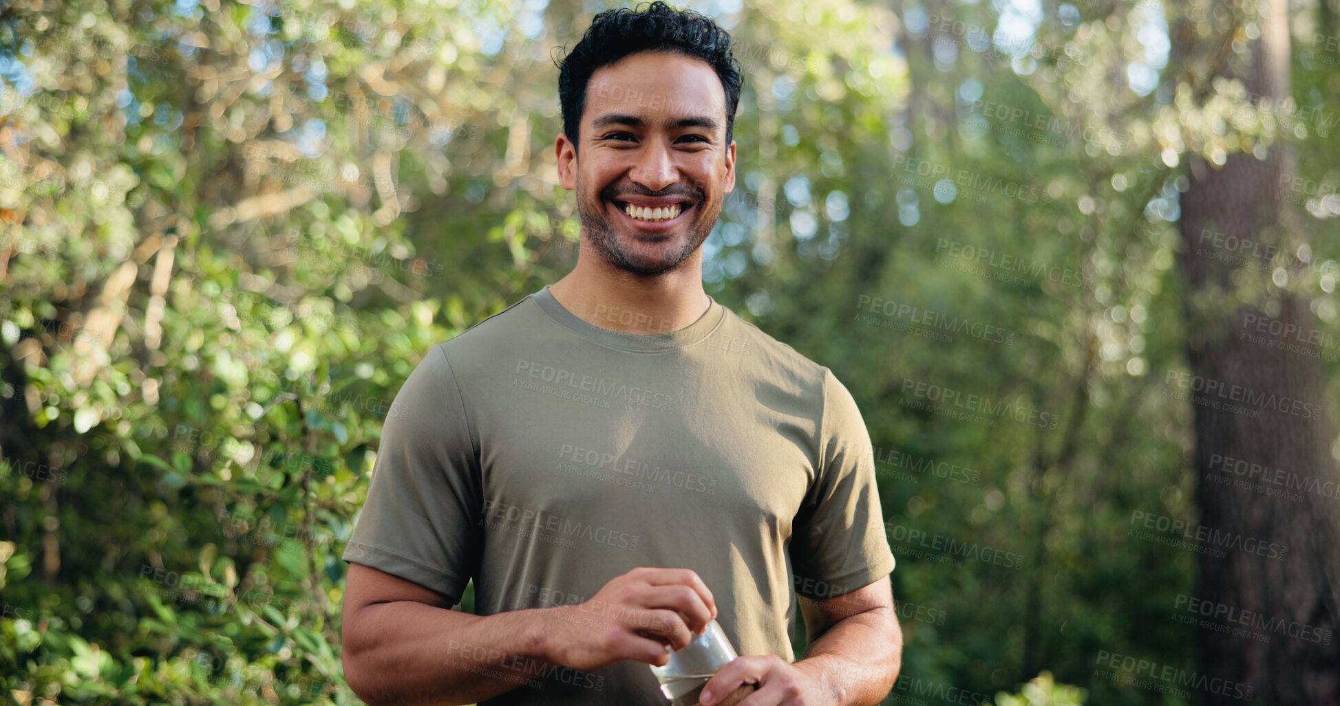 Buy stock photo Happy man, portrait and fitness with water bottle in nature for hydration or outdoor recovery. Active, male person or runner with smile or mineral liquid for natural sustainability or break in forest