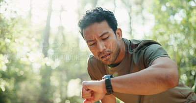 Buy stock photo Tired, athlete and man with smart watch, outdoor and workout progress on fitness app and heart rate. Park, runner and person with technology for exercise update, break and health monitoring in nature