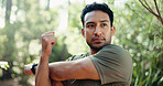 Fitness, man and stretching with arms in forest for workout preparation, start or begin in nature. Active, male person or runner getting ready with warm up in woods for outdoor training or exercise