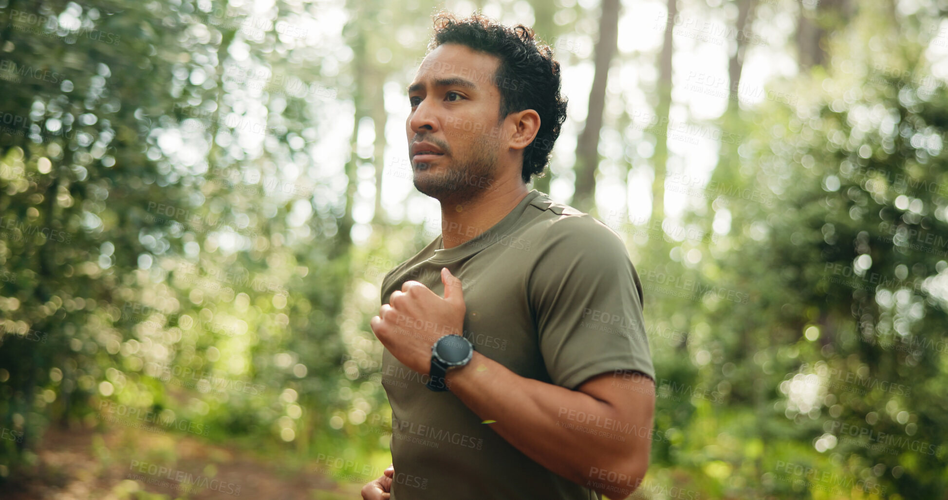 Buy stock photo Fitness, workout and man in nature with running, cardio and stamina training in sport challenge. Wellness, bokeh and athlete in forest with jog, outdoor trail and endurance exercise in Costa Rica.