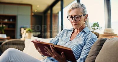 Buy stock photo Reading, book and mature woman in house with glasses, calm and literature insight on weekend rest. Free time, knowledge or senior person with specs, relax and information guide on Saturday afternoon.