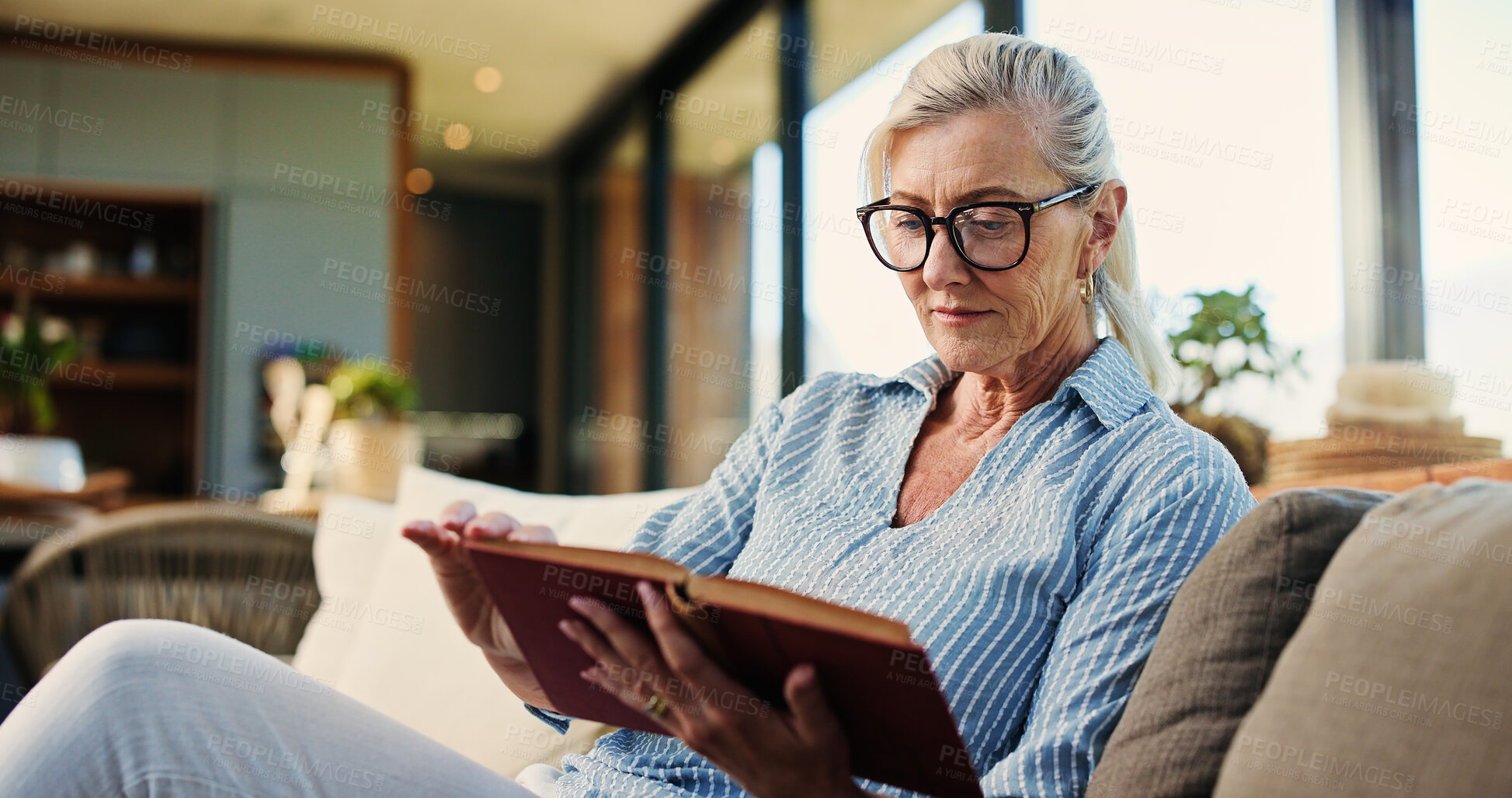 Buy stock photo Reading, book and mature woman in house with glasses, calm and literature insight on weekend rest. Free time, knowledge or senior person with specs, relax and information guide on Saturday afternoon.