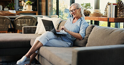 Buy stock photo Happy, woman and reading in home with laptop, glasses and remote work for writing online story. Mature person, smile and review article in house with computer for blog, journalism and freelance job.