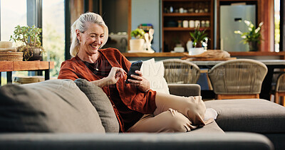 Buy stock photo Old woman, phone and laugh on sofa with texting, notification and funny chat in living room at house. Person, smartphone and happy with mobile app, contact and social network on couch at apartment
