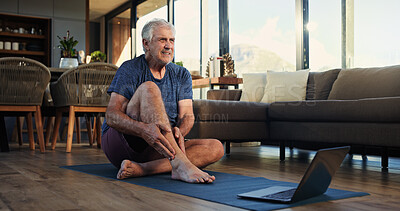 Buy stock photo Fitness, laptop and senior man with ankle pain, injury or accident with virtual exercise or training. Computer, health and elderly male person with muscle sprain for online workout in living room.