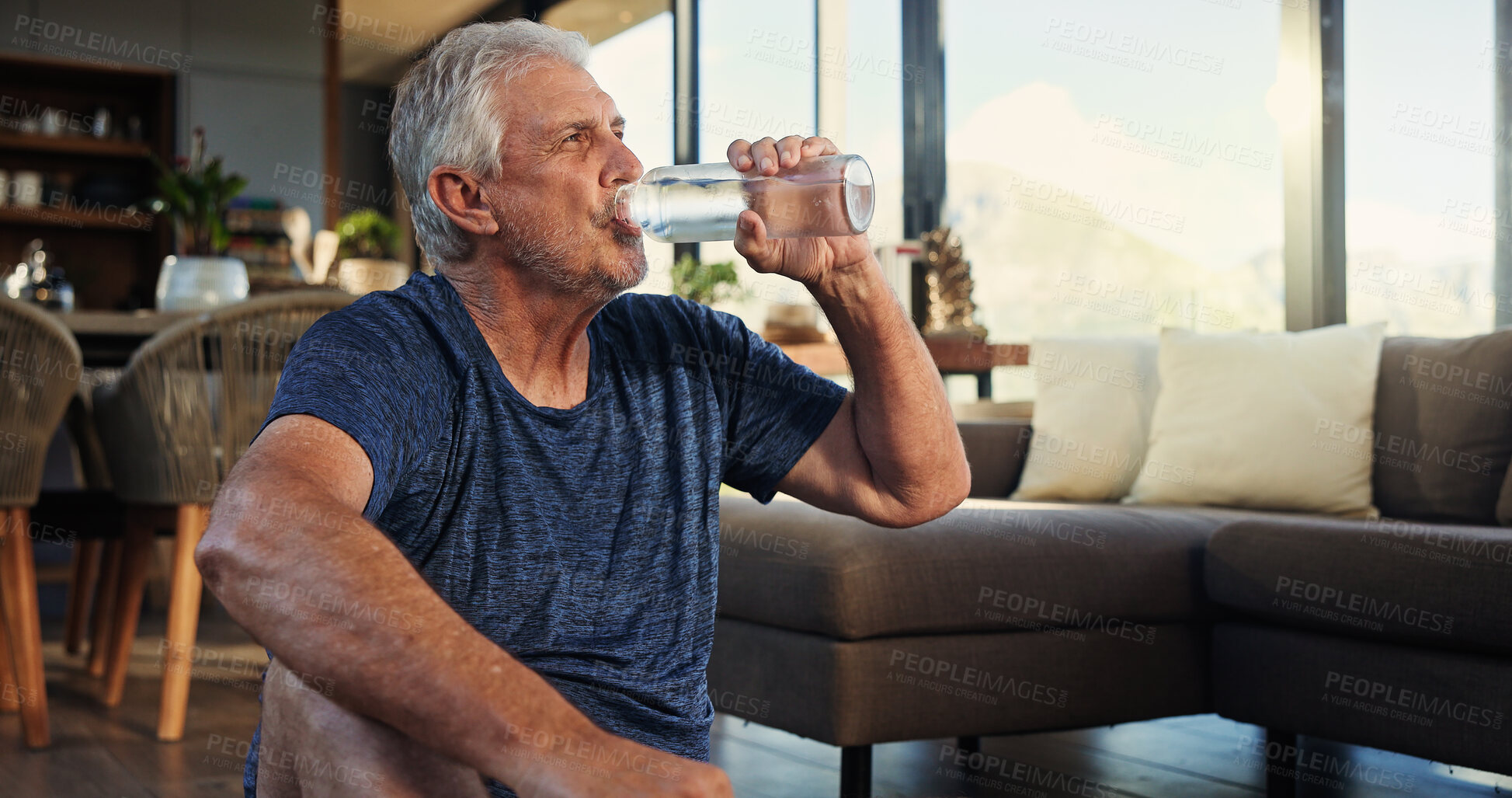 Buy stock photo Home, yoga and old man in lounge, drinking water and relax with break, hydration and rest. Apartment, pensioner and senior person with health, thirsty and liquid with nutrition, fitness or wellness