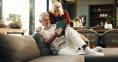 Buy stock photo Online, tablet and senior couple on sofa for subscription, connection and website in home. Retirement, happy marriage and old man and woman on digital tech for bonding, streaming and relax together