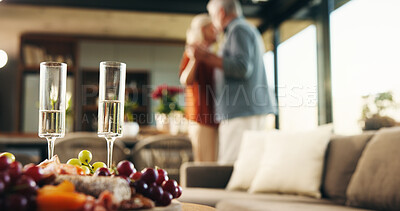 Buy stock photo Charcuterie board, house and old couple with champagne, dancing and bonding together with love. Music, man and woman with alcohol, fruit and anniversary with celebration, marriage and snack platter