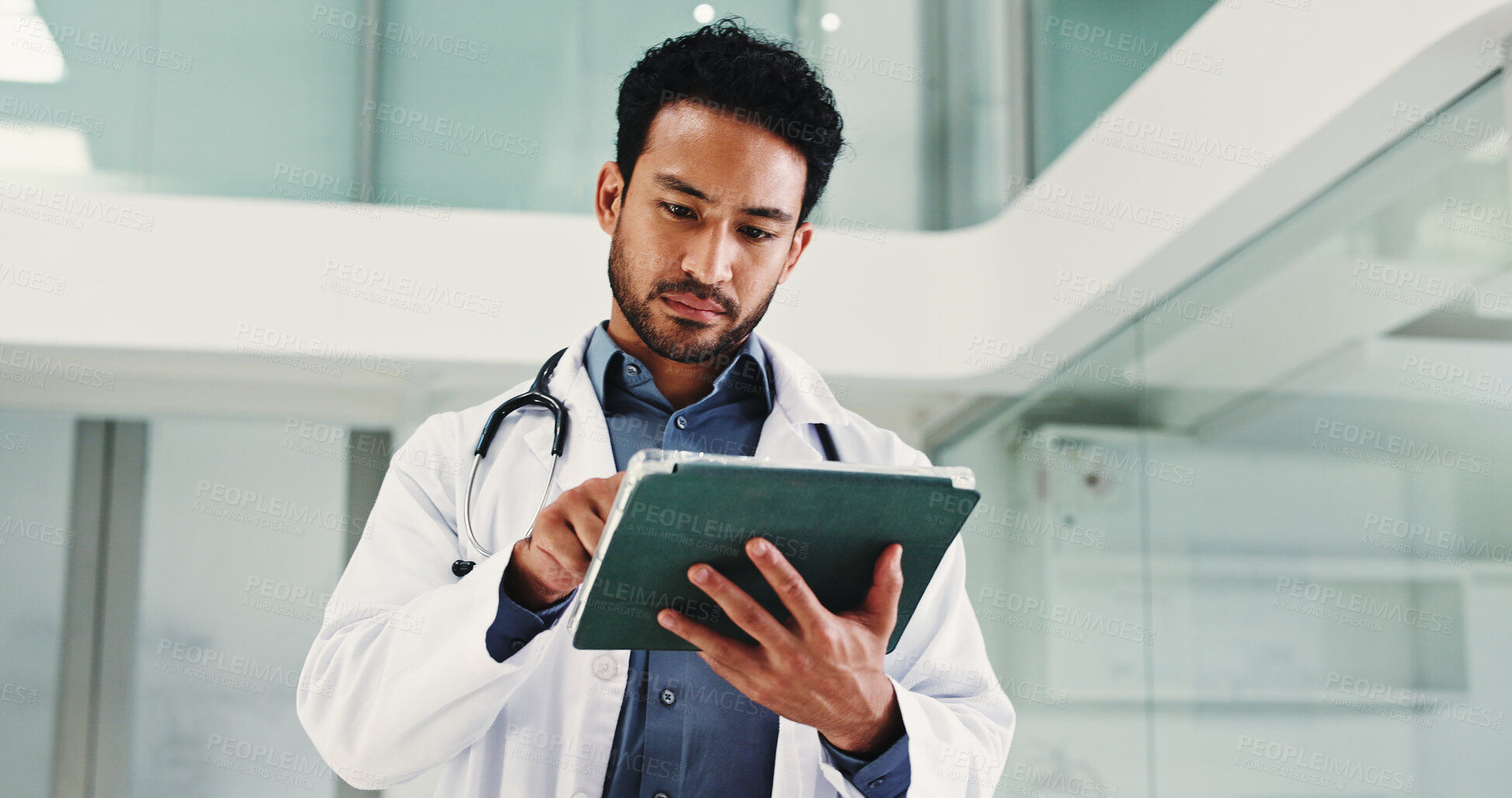 Buy stock photo Below, man and doctor with tablet in hospital for research, medical report and confirm surgery. Male surgeon, digital and browsing website for Telehealth, healthcare results and treatment information