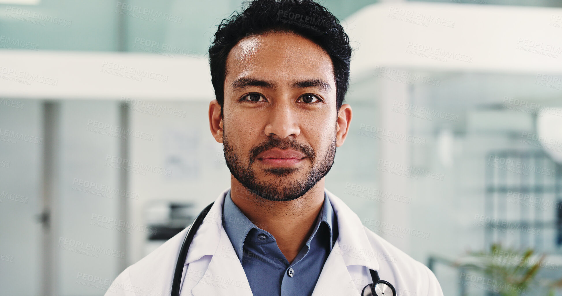 Buy stock photo Man, doctor and portrait in hospital, lobby and confidence with pride, career and medical services. Person, healthcare professional and hallway for job, wellness and employee at clinic in Malaysia