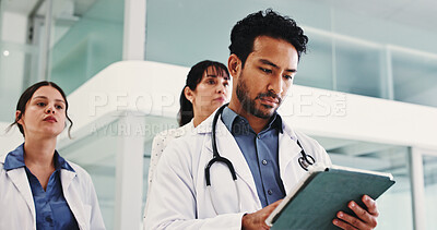 Buy stock photo Tablet, typing and man in hospital, doctors and medical service with research for treatment. Group, women and employees in clinic, tech and internet with healthcare and email for online schedule