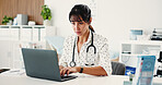 Woman, doctor and typing with laptop in hospital for research, medical report and confirm surgery. Female person, pc and reading protocol for Telehealth, healthcare results and treatment information