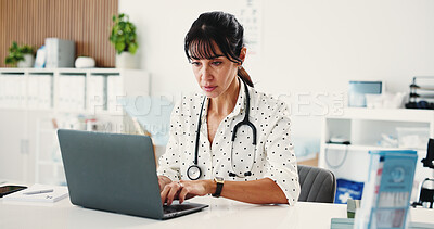 Buy stock photo Woman, doctor and typing with laptop in hospital for research, medical report and confirm surgery. Female person, pc and reading protocol for Telehealth, healthcare results and treatment information