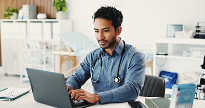 Buy stock photo Man, doctor and reading with laptop in hospital for research, medical report and confirm surgery. Male person, pc and schedule appointment for Telehealth, healthcare results and treatment information