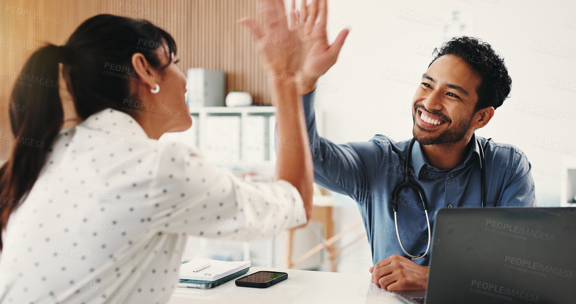 Buy stock photo Happy people, doctor and laptop with high five for winning, success or teamwork in hospital. Woman, man or medical workers with smile for health procedure, good job or well done together in clinic