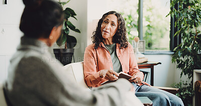 Buy stock photo Women, therapist and talking in office, mental health and feedback for life coaching session. People, psychologist and client with conversation, anxiety and person with depression and trauma recovery