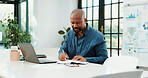 Laptop, writing and business black man with notebook for financial review, statistics or budget report. Startup office, planning and person with graphs, documents and research for finance analysis