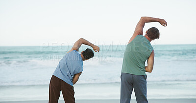 Buy stock photo Personal trainer, outdoor and people stretching on beach, workout training practice and warm up routine. Fitness coach, back or men with bend exercise for mobility, posture or wellness support by sea